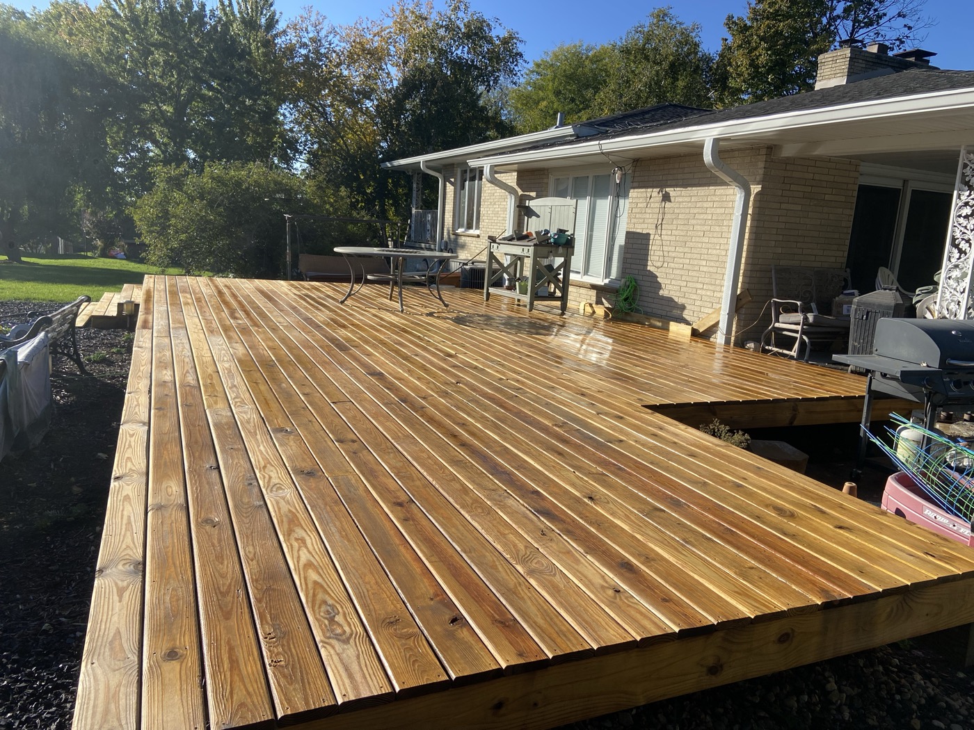 Deck finished with penetrating oil-based stain — rich, even color with no peeling